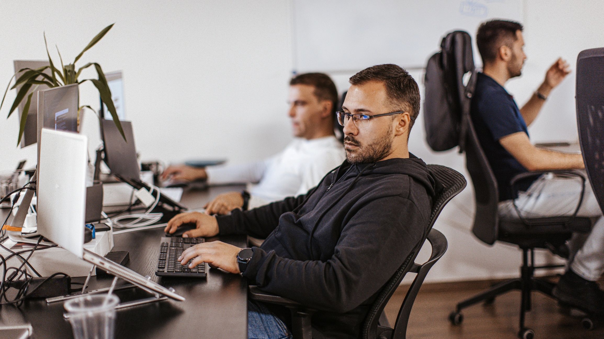 IT team collaborating to support cloud productivity tools