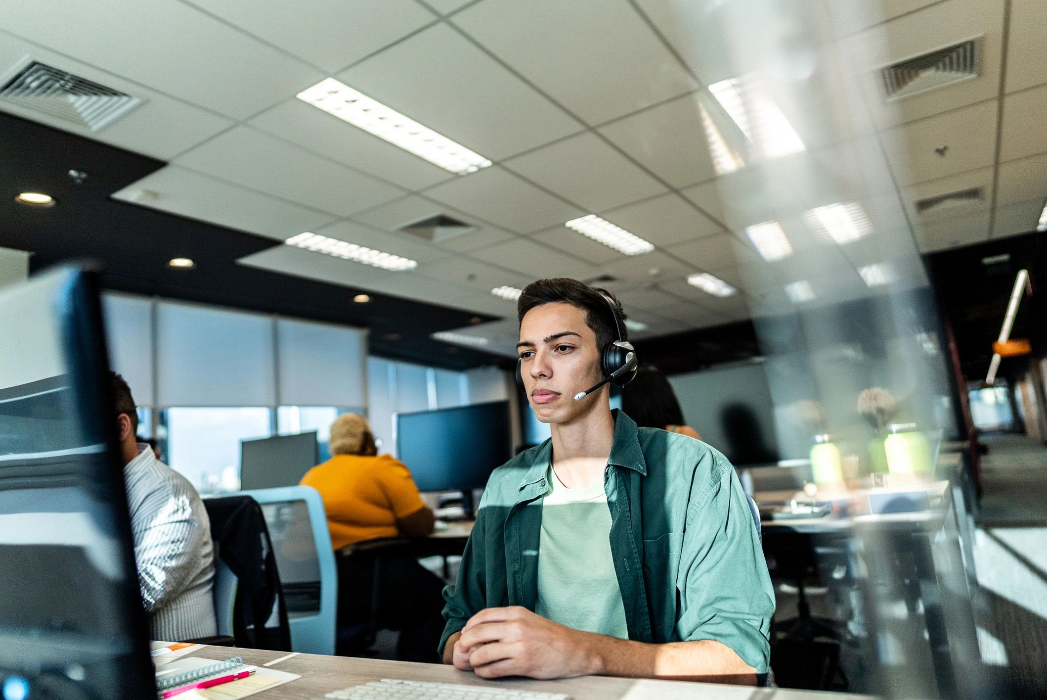 IT support professional working at a computer in an office