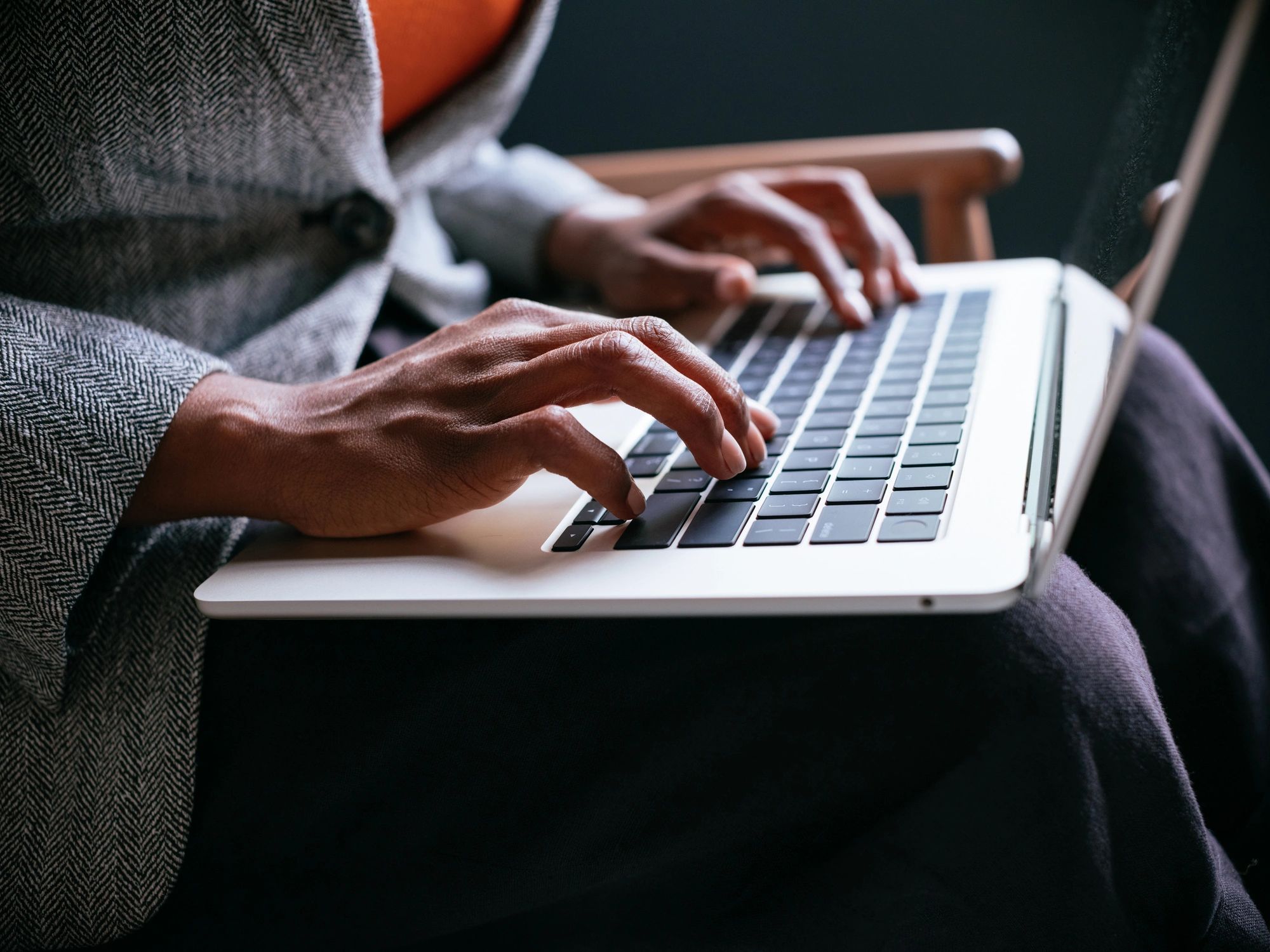 Help desk support professional working on a laptop