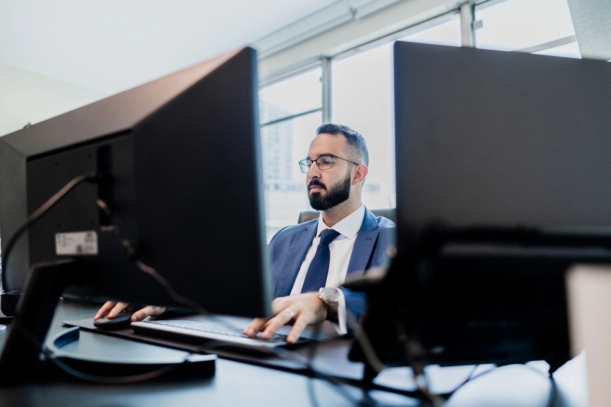Professional working at a computer in an office